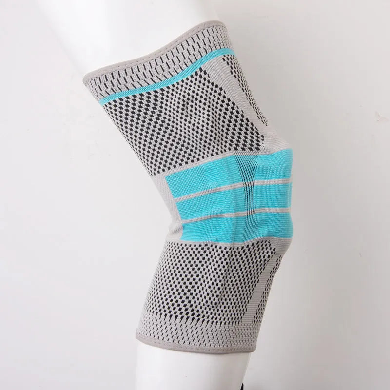 Sky blue silicone knee pad for sports, shown with elastic fibre strap and protective knee section.