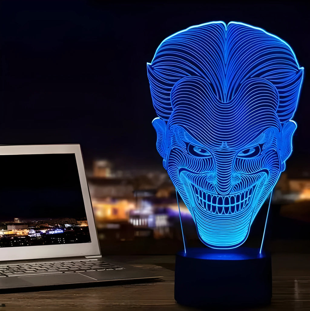 USB-powered 3D acrylic LED lamp showing seven colour options and remote control on a desk.
