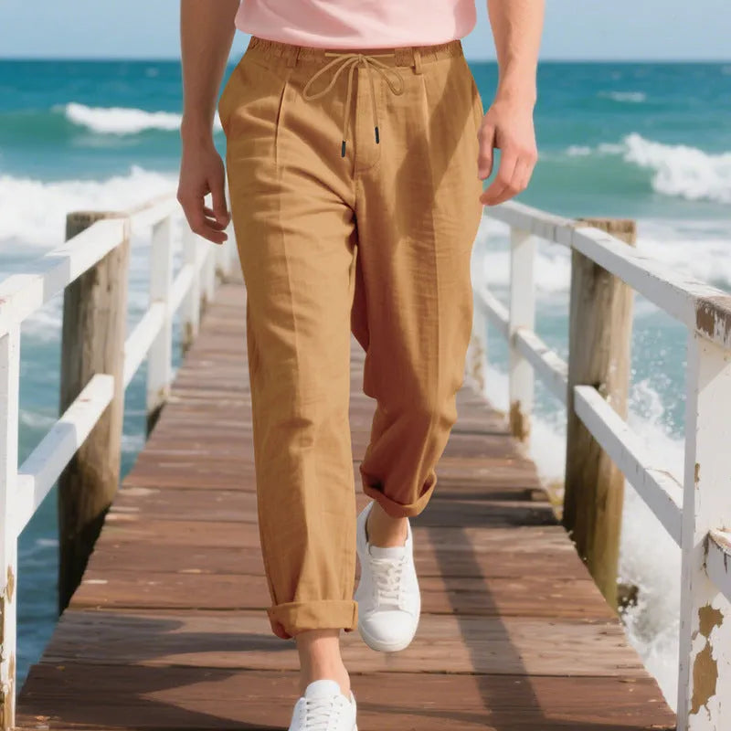 Men's linen casual trousers in light khaki colour with loose straight-leg fit and drawstring waist