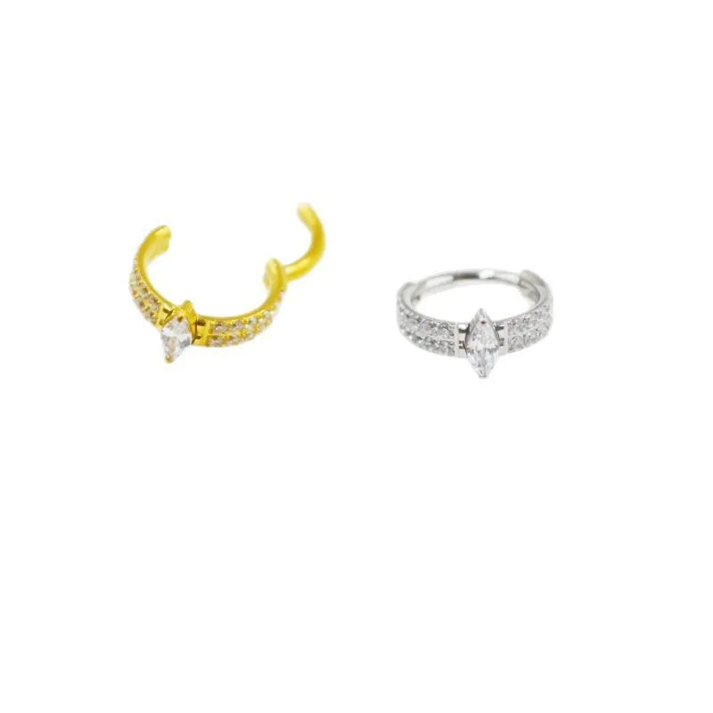 Close-up of a heart-shaped zirconia earring on a 316L steel post in silver tone.