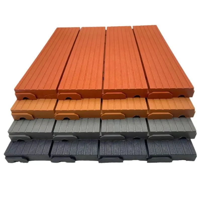 Plastic interlocking floor tiles in wood grain finish showing non-slip surface and edge connection.