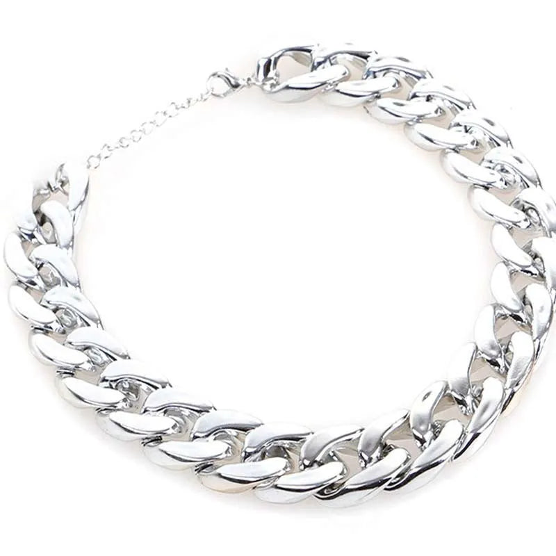 Geometric dog collar ornament with twisted chain buckle in gold, rose gold, and white colours.