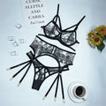 Women's black lace three-piece set with floral print showing top, pants and waist ring on hanger