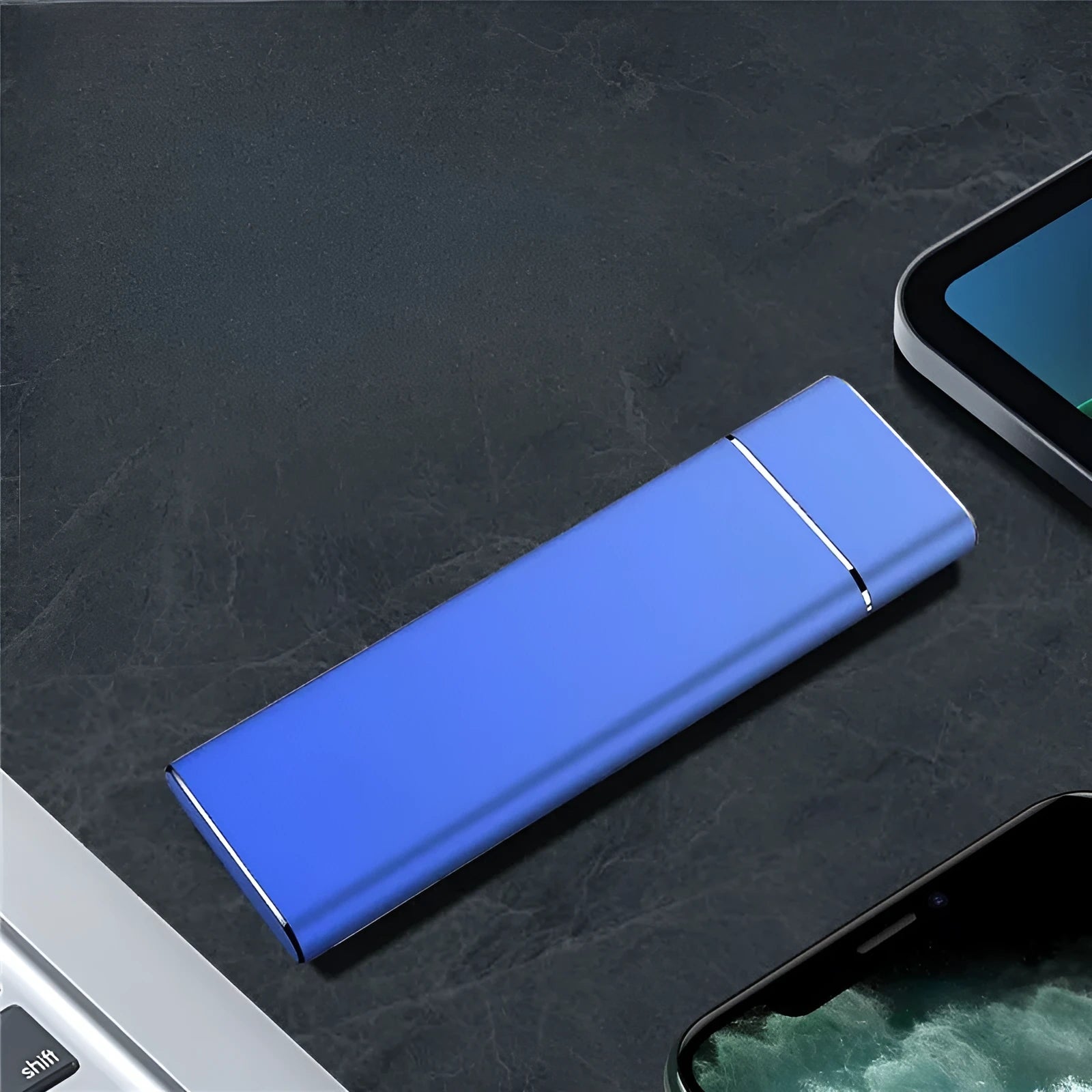 Sapphire blue portable external solid state hard drive with metal shell, shown next to its USB cable.