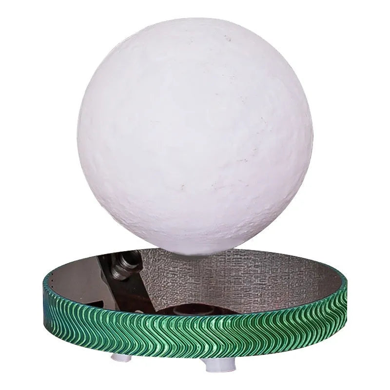 Magnetic levitating moon night lamp with 3D printed texture on a bedside table.
