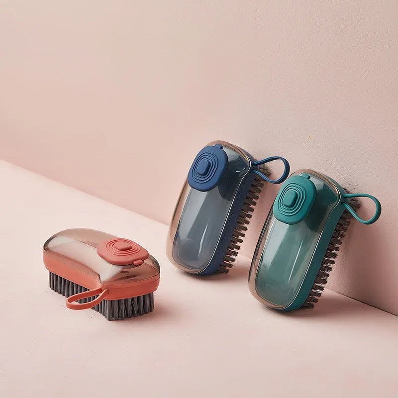 Multifunctional automatic liquid cleaning brush with ergonomic grip in blue showing built-in reservoir and soft bristles
