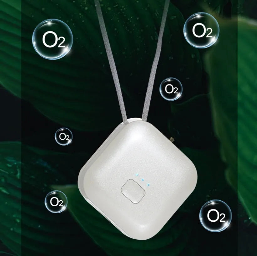 Compact pink USB air purifier necklace with negative ion technology and USB charging port