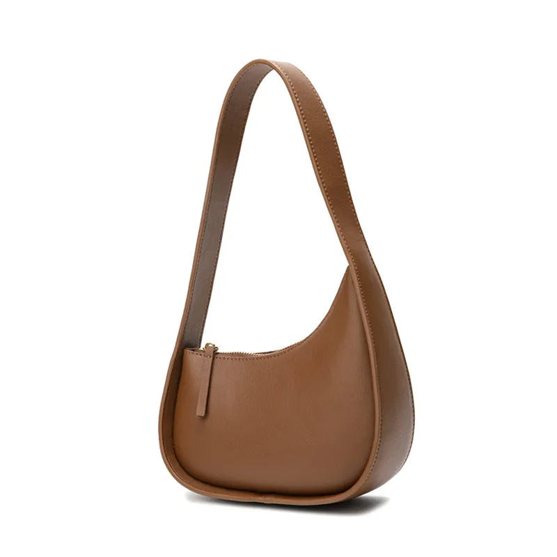 Genuine leather ladies shoulder bag in half moon shape with wide strap