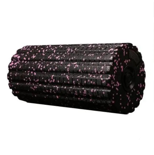Black 4 speed vibrating massage roller foam on a floor for muscle recovery use