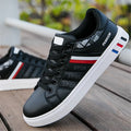 A pair of men's sports shoes shown in black, also available in grey and white, with size tags indicating 39 to 44.