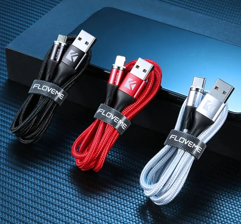 Black magnetic data cable with USB-C connector and side LED light, laid flat next to its aluminium foil packaging.