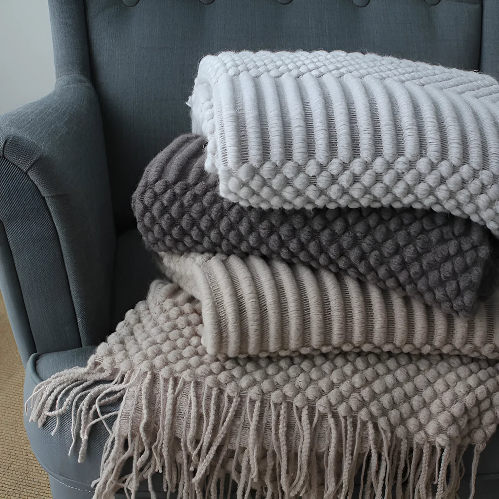 Small grey polyester nap blanket folded to show its 127x170cm size