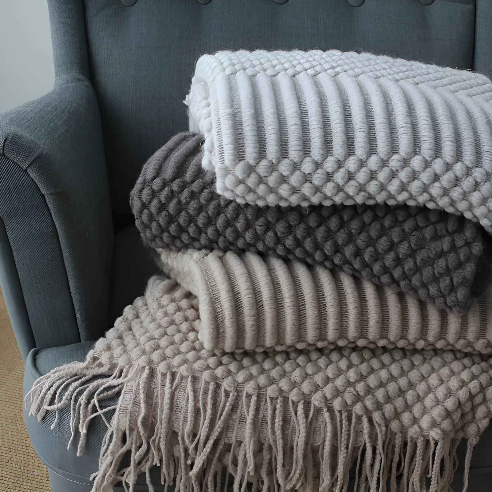 Small grey polyester nap blanket folded to show its 127x170cm size