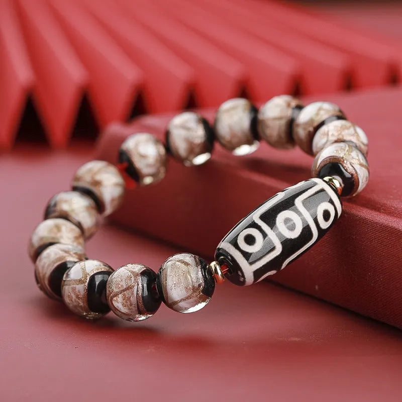 Snake year lucky bracelet with multicoloured glazed beads in Chinese auspicious patterns.