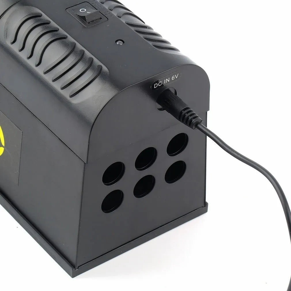 Black high voltage trigger rodent killer on a floor, 2W 6V 20Hz, 208x115x75mm