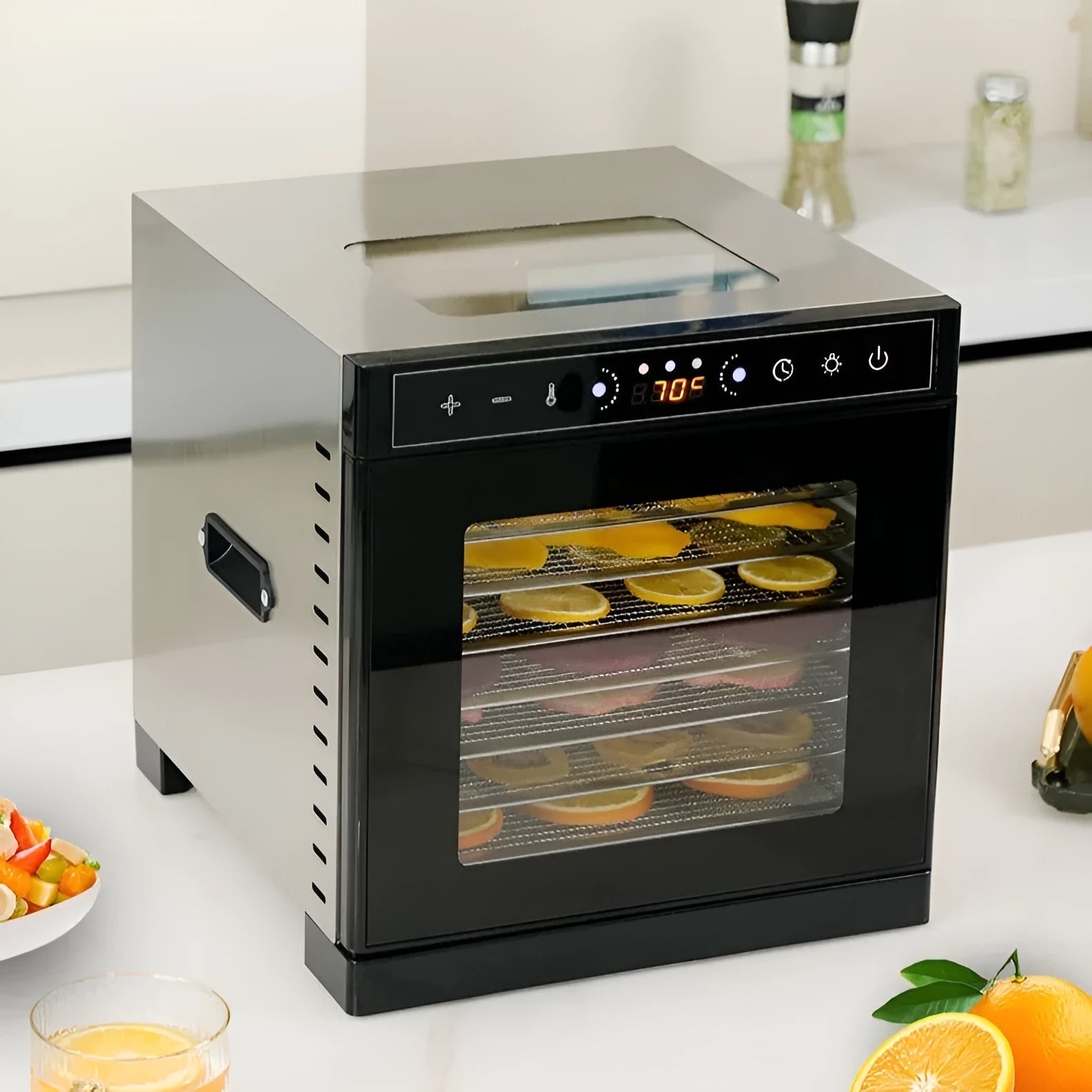 Stainless steel food dehydrator machine with multiple stacking trays and an LED control panel.