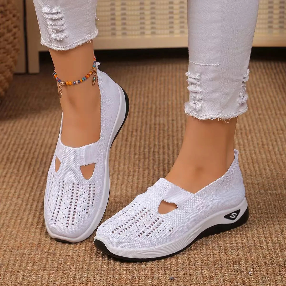 Soft-bottom casual mesh shoes with T-strap in multiple colours on a flat heel and round toe.
