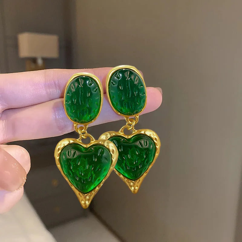 Silver needle pleated oval love heart alloy stud earrings in purple, red, green, and yellow-white.