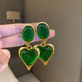 Silver needle pleated oval love heart alloy stud earrings in purple, red, green, and yellow-white.