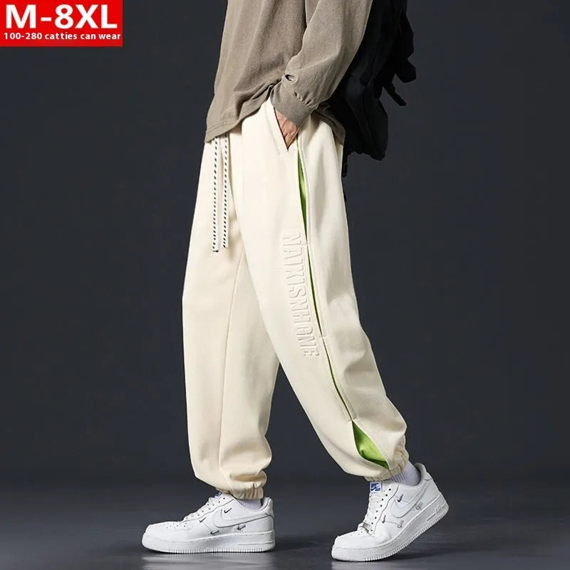 Men's cotton trousers with ankle bands and stitching detail in grey green colour