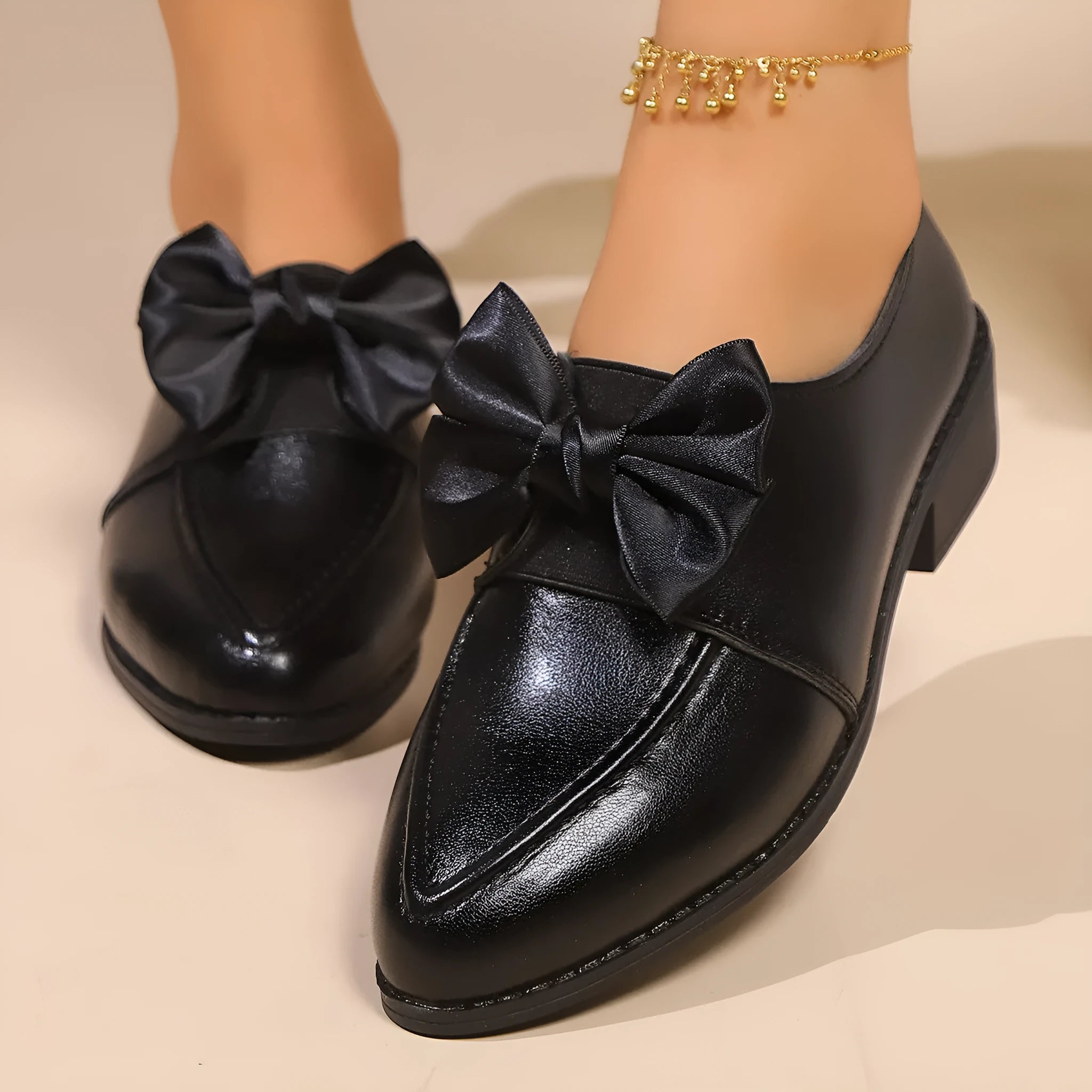 Women's flat shoes with a pointed toe and a choice of bow or buckle detail on the upper.
