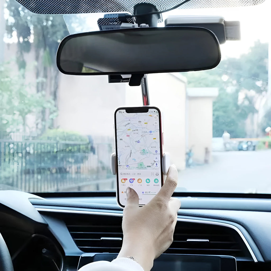 Black ABS plastic mobile phone bracket mounted on a car rearview mirror holding a smartphone