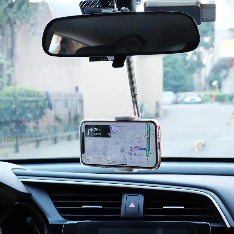 Black ABS plastic mobile phone bracket mounted on a car rearview mirror holding a smartphone