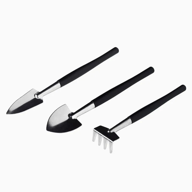 15-piece black mini garden hand tool set for succulent and bonsai plants on a grey cushion.