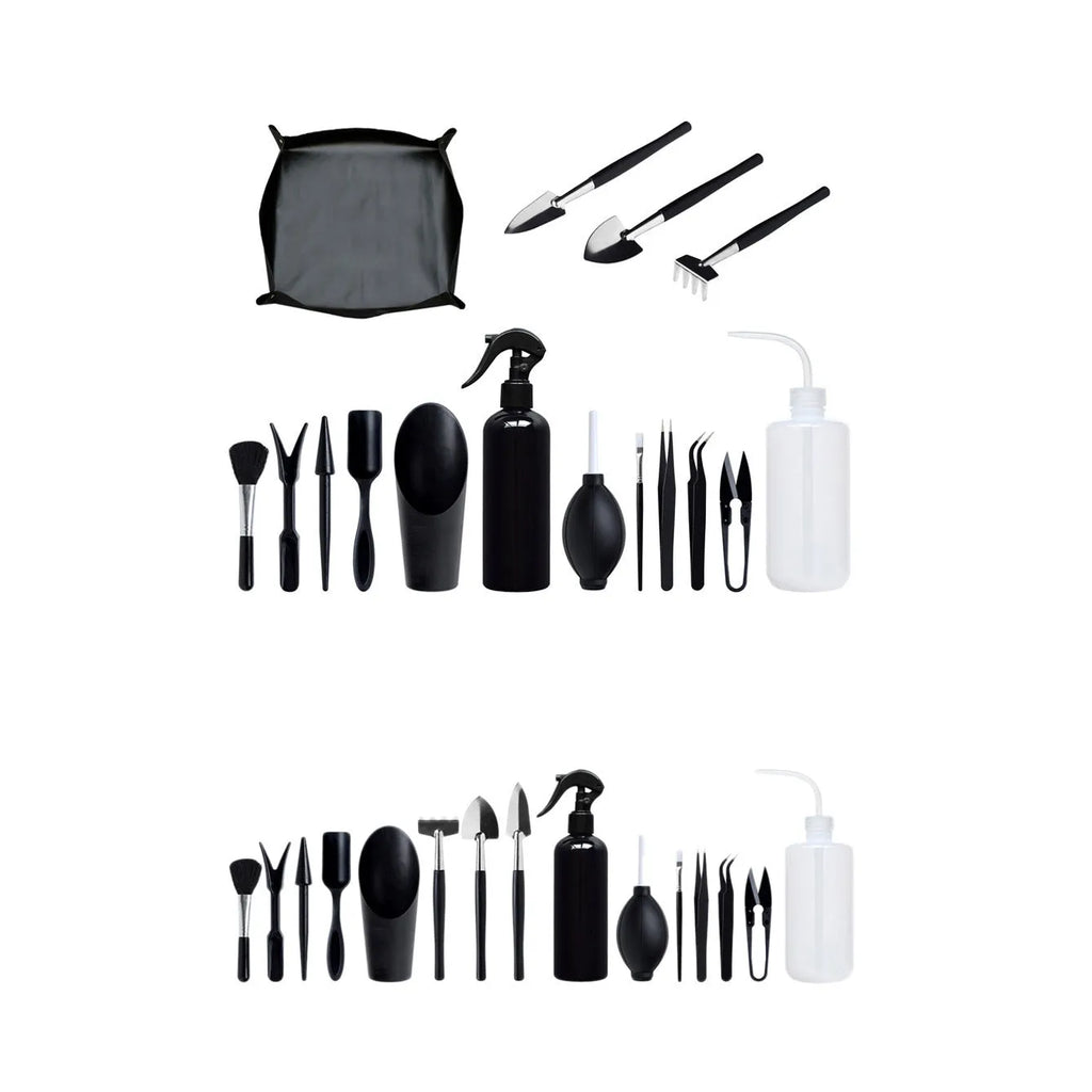 15-piece black mini garden hand tool set for succulent and bonsai plants on a grey cushion.