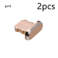 Aluminium alloy iPhone charging port dust plug in rose gold colour next to an iPhone.