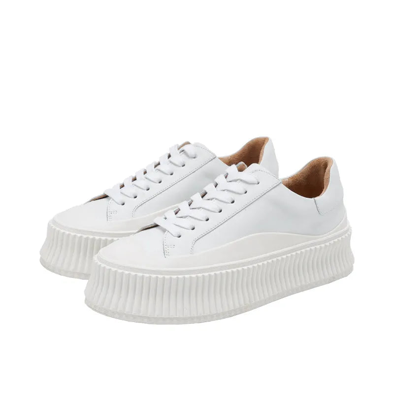 Women's black suede thick-sole lace-up trainers with back lacing on a white background