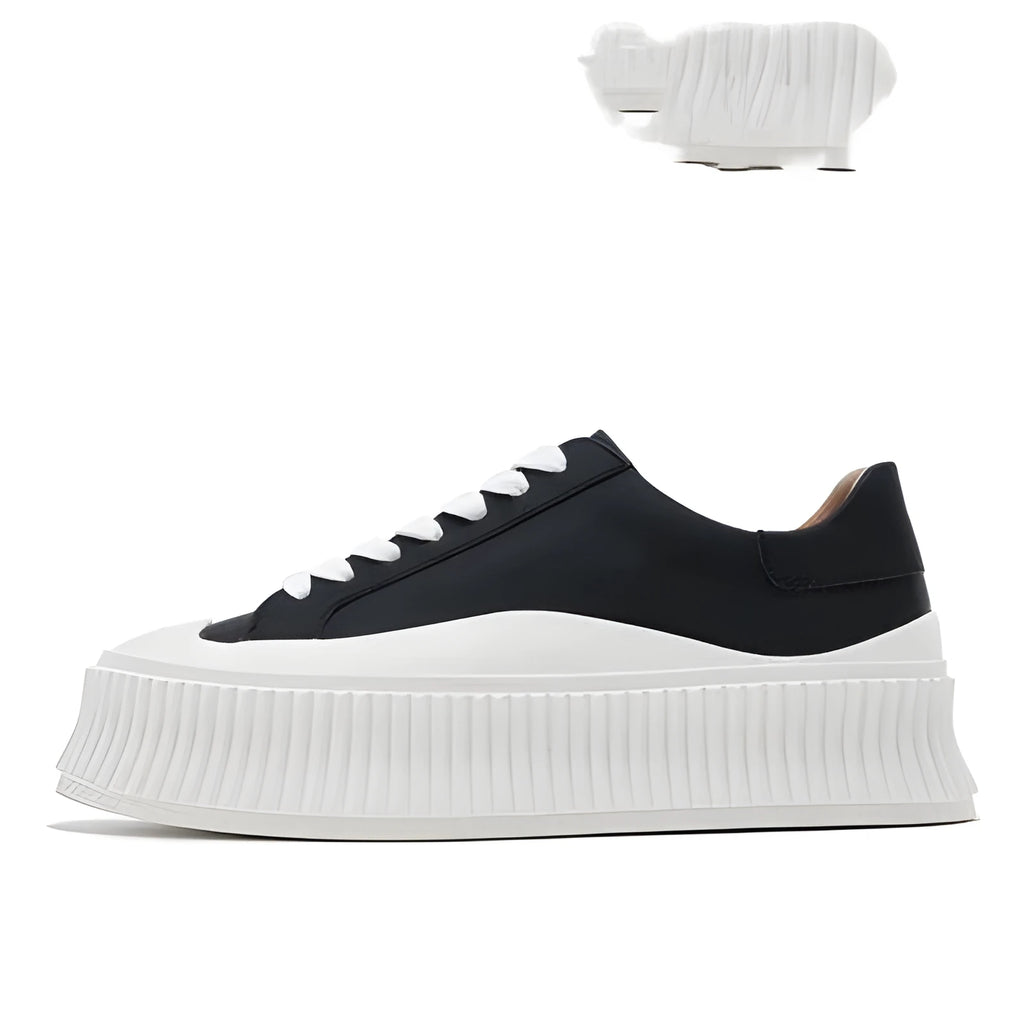 Women's black suede thick-sole lace-up trainers with back lacing on a white background
