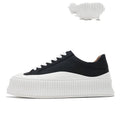 Women's black suede thick-sole lace-up trainers with back lacing on a white background