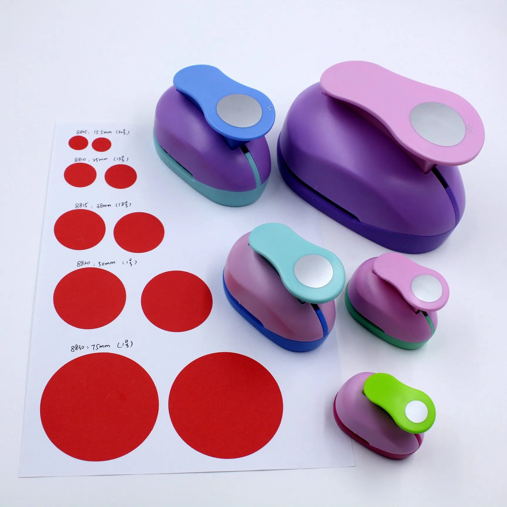Round children's puzzle embossing machine with colourful finish and six round dies from 9mm to 75mm