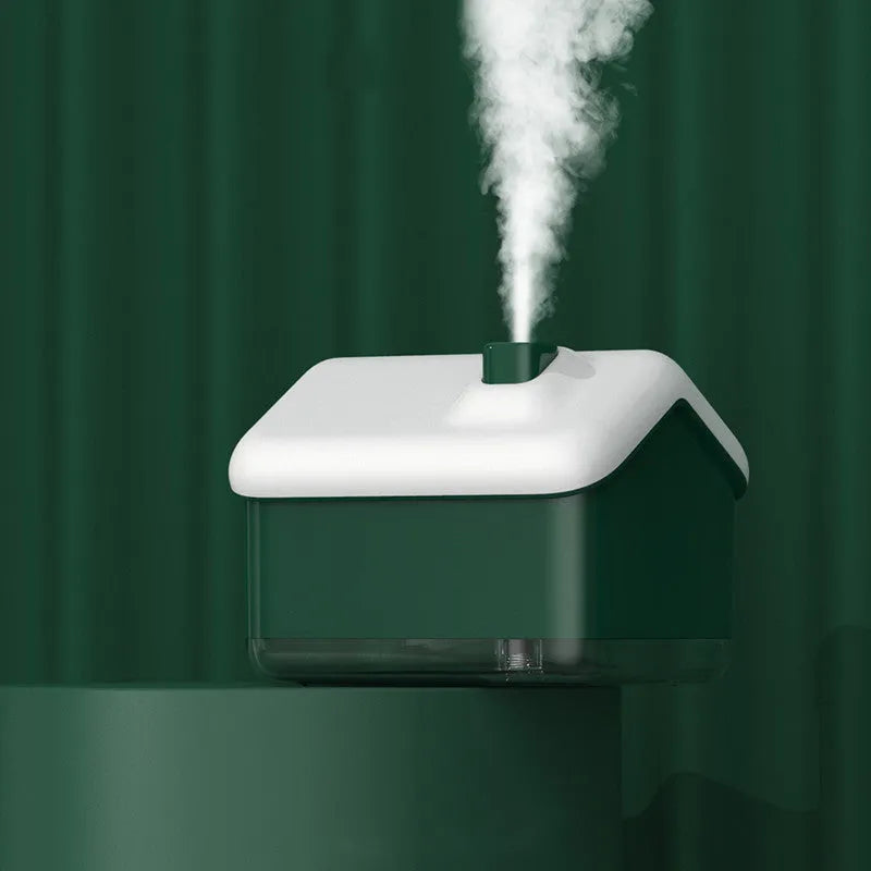 White Igloo-shaped ultrasonic humidifier and essential oil diffuser with LED light on a wooden table.