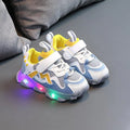 Children's bright light mesh Velcro sneakers in black, grey, or pink with a rubber sole.