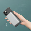 Silver Apple wireless power bank with 5000mAH capacity and magnetic charging