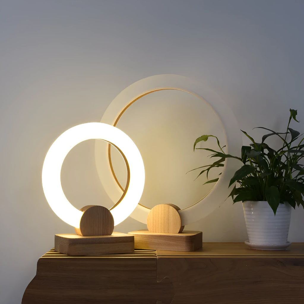 Nordic style circular wooden art chandelier with acrylic shade hanging from a ceiling.