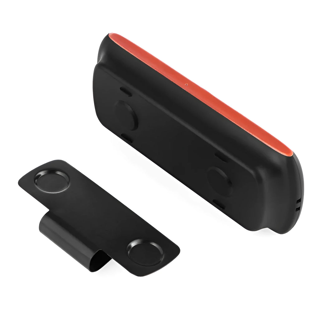 Orange plastic Bluetooth hands-free car kit mounted on a sun visor.