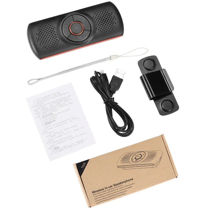 Orange plastic Bluetooth hands-free car kit mounted on a sun visor.