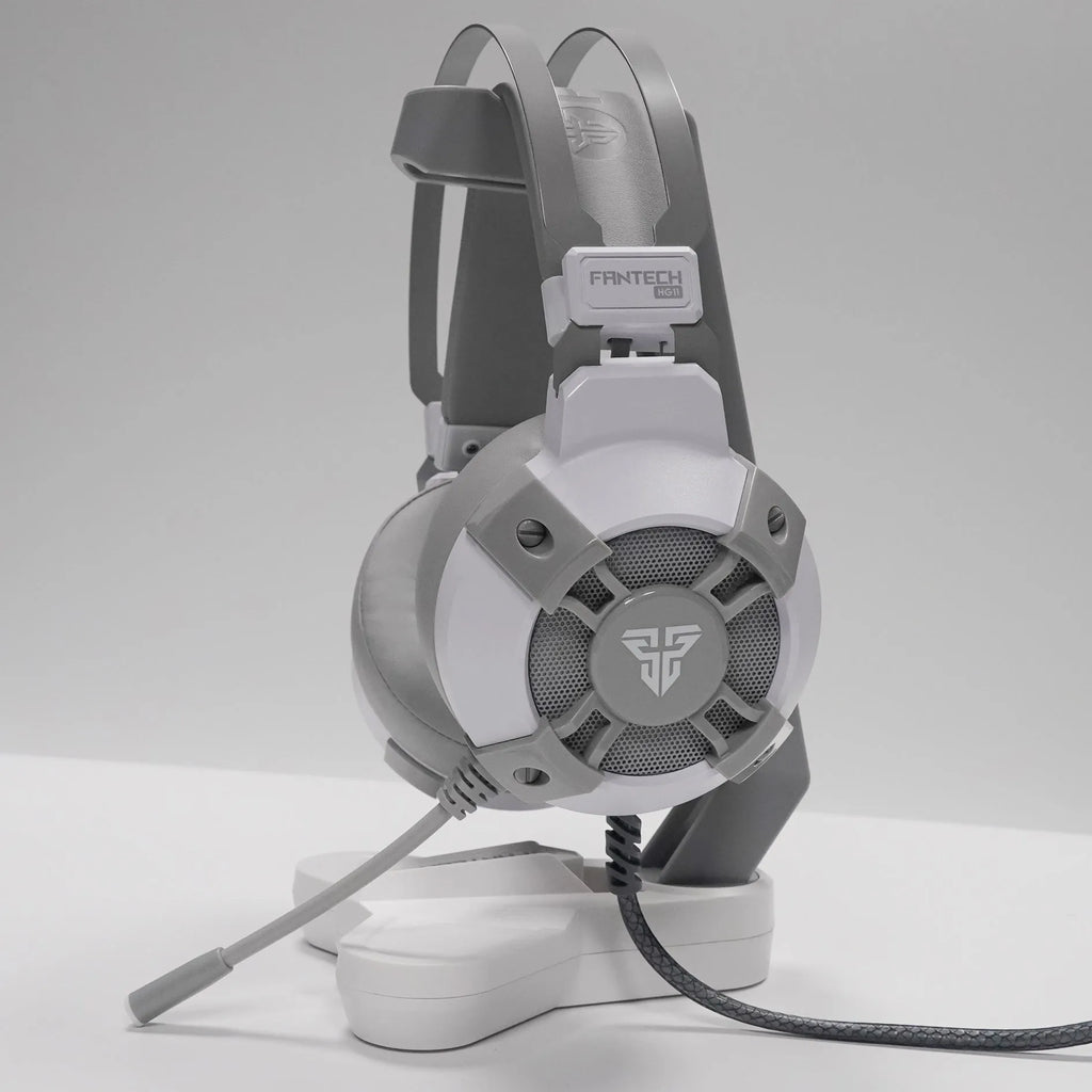 Black FANTECH HG11 gaming headset with RGB lights on ear cups and a USB cable.