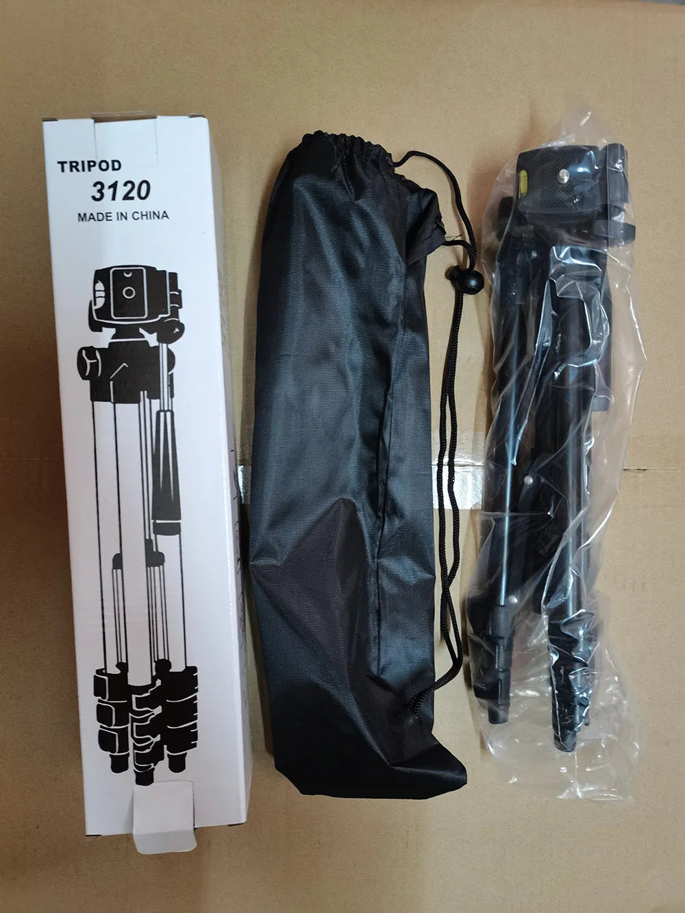 Black aluminium camera tripod with 3D head extended to maximum height