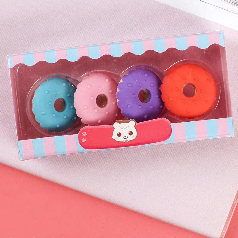 Set of 12 cartoon erasers with ice cream, donut, lollipop, and cone designs for children.