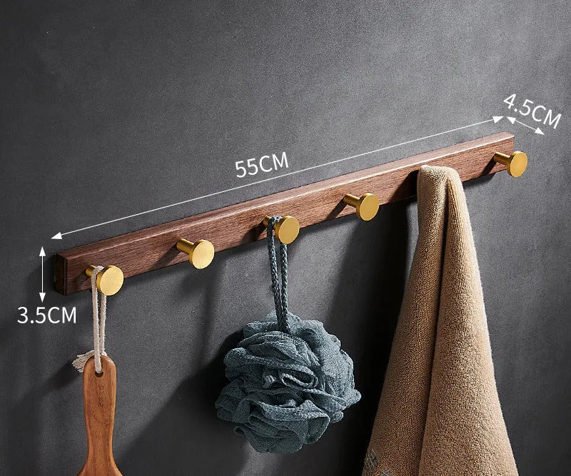 Black walnut aluminium clothes hooks with brass wire drawing finish on a bathroom wall