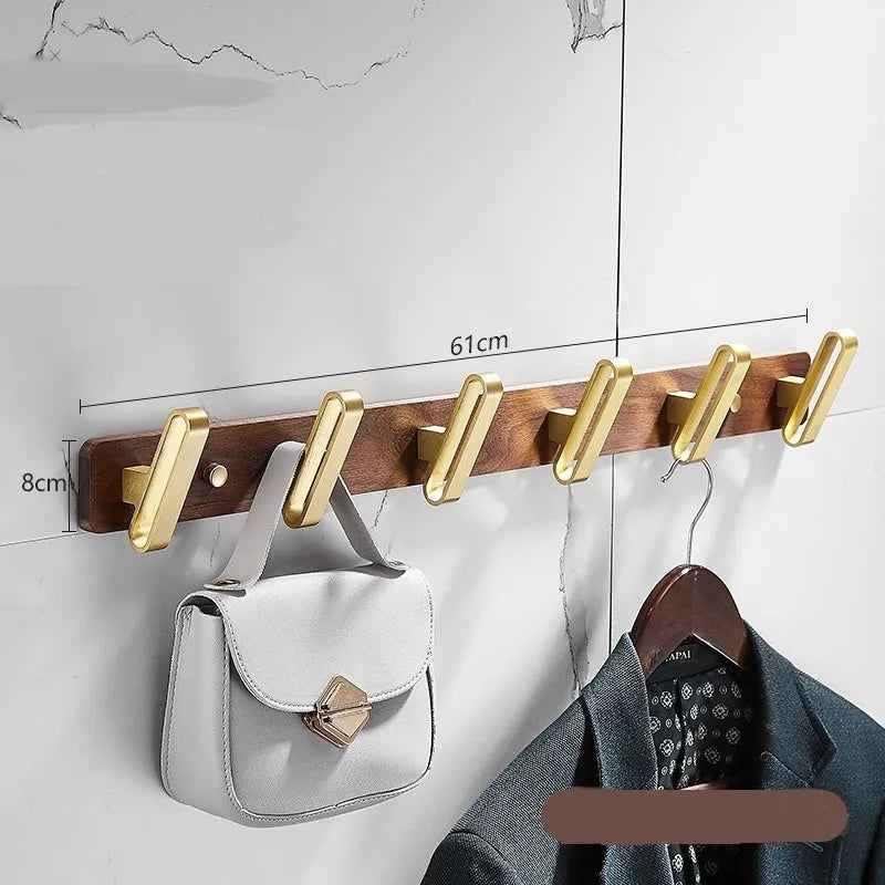 Black walnut aluminium clothes hooks with brass wire drawing finish on a bathroom wall