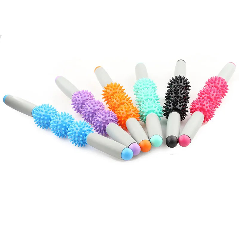 Anti cellulite massager stick with hedgehog-shaped balls and green padded ergonomic handles on a white background