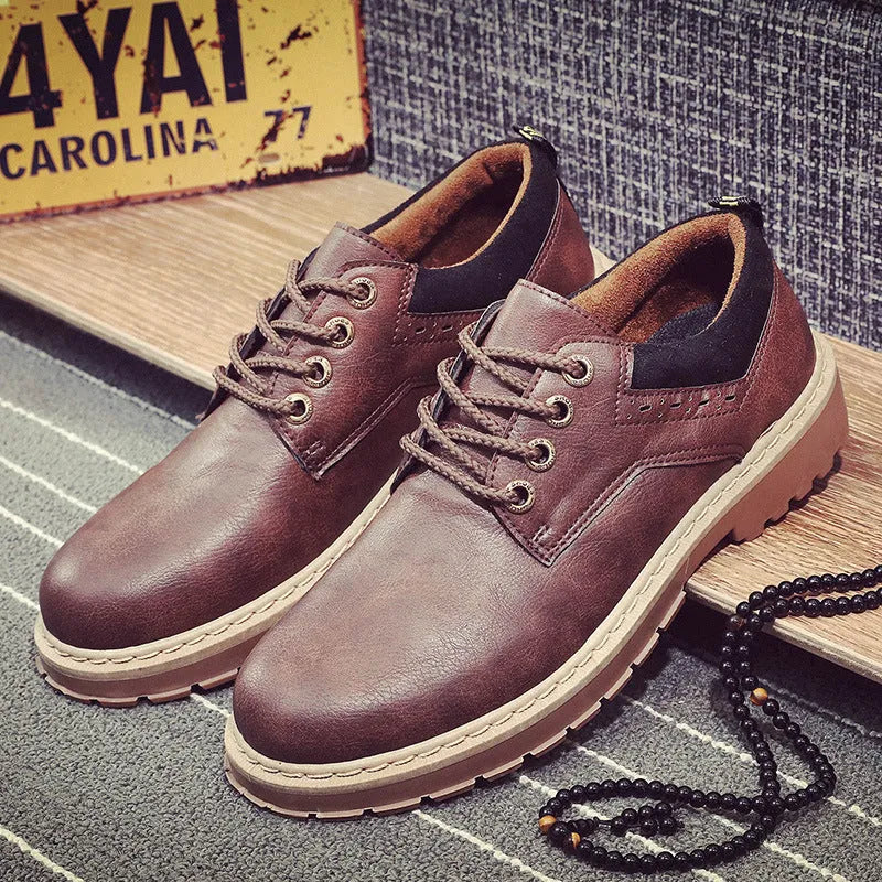 Men's black casual lace-up shoes with a round toe and low-cut design on a rubber sole.