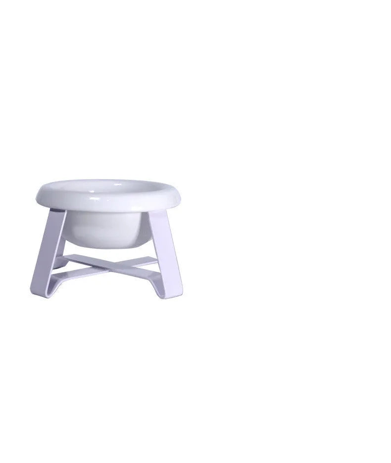 Elevated ceramic cat feeding bowl with gold iron stand and stainless steel surface in pink colour