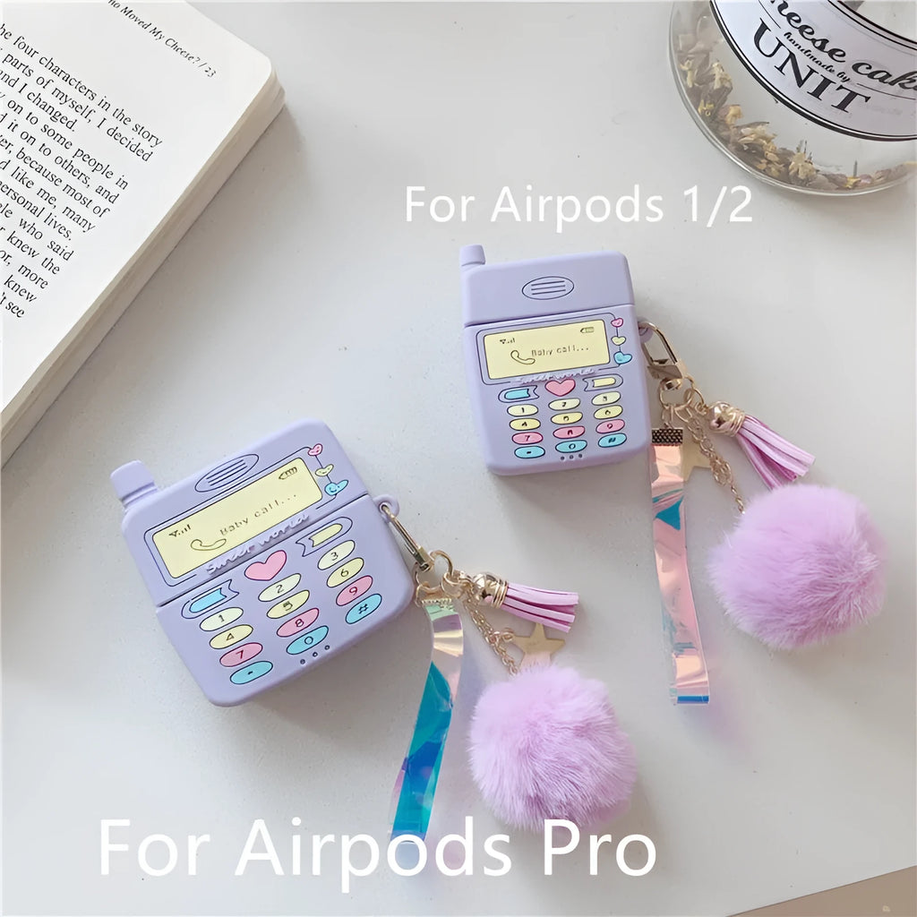 Purple silicone protective case for Apple AirPods with a small furry purple pendant attached.