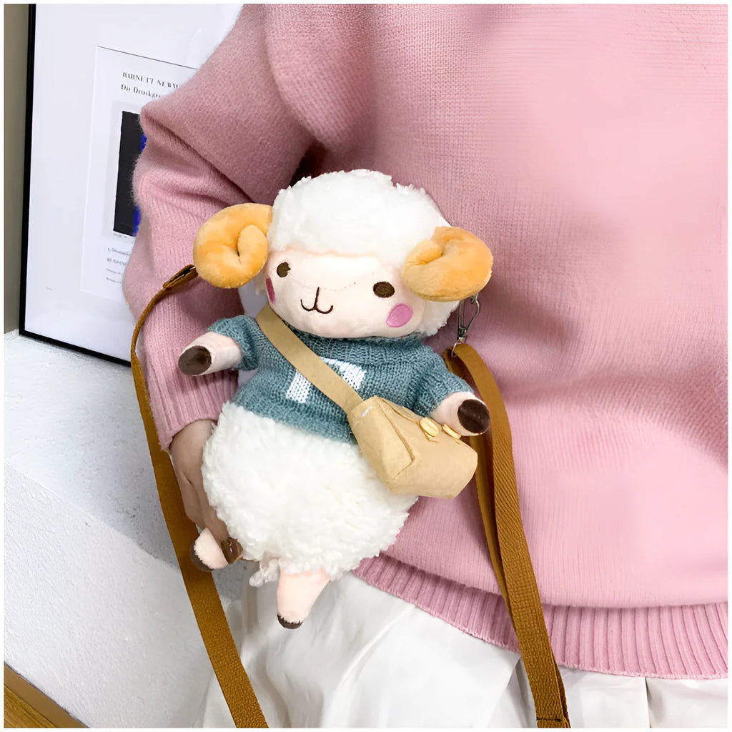 Little Sheep plush crossbody bag in blue with lamb pattern, showing small square shape and soft handle